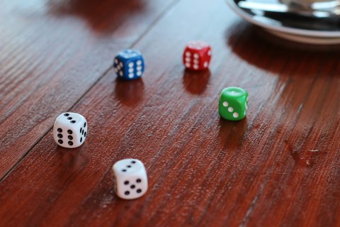 Five assorted color dice