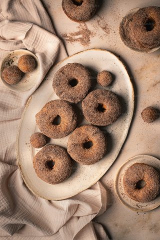 White plate with donuts on top 