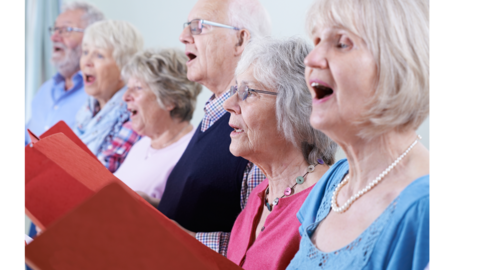 men and women singing