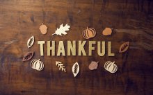 Brown board with the word Thankful