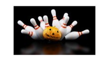 Bowling pins being knocked down by a pumpkin